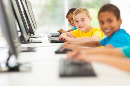 21186555 - group of happy elementary school students in computer room